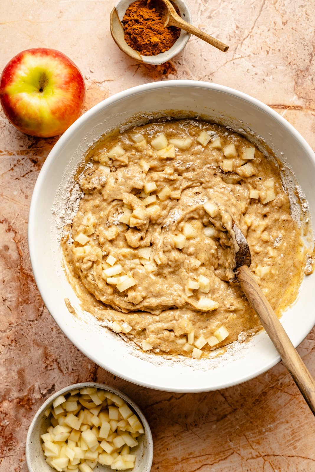 mixing batter for an apple snacking cake