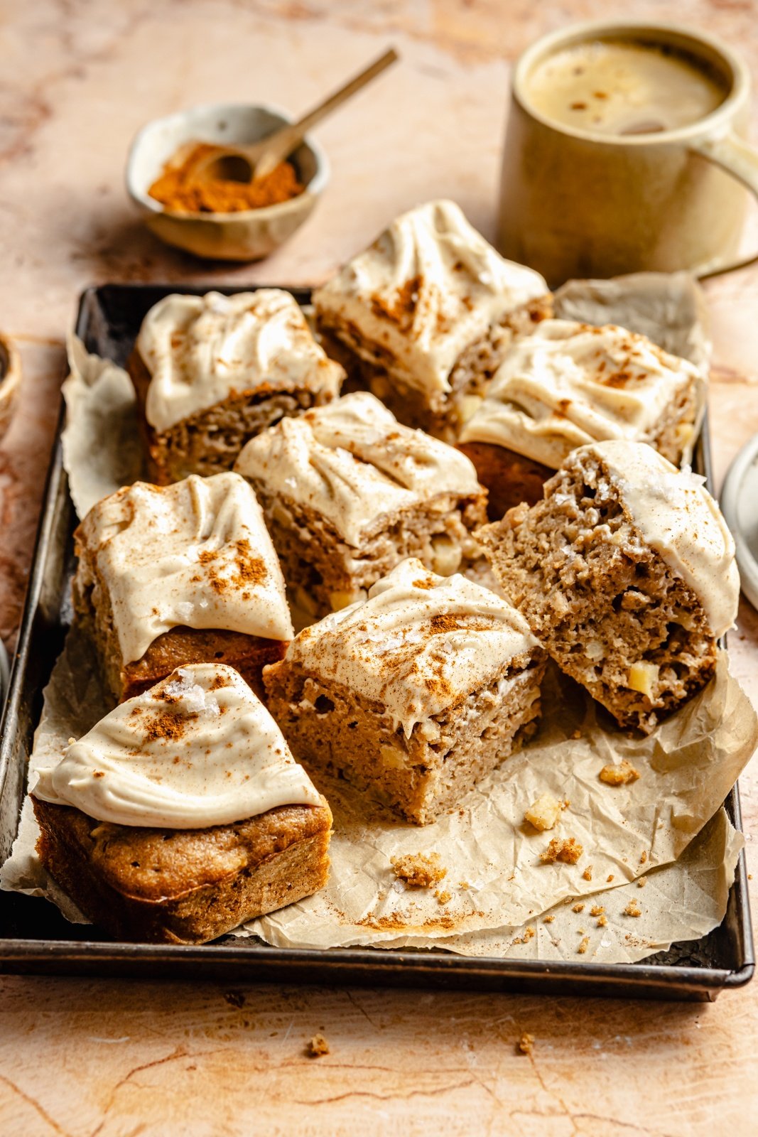 apple cake with brown butter frosting on a baking pan