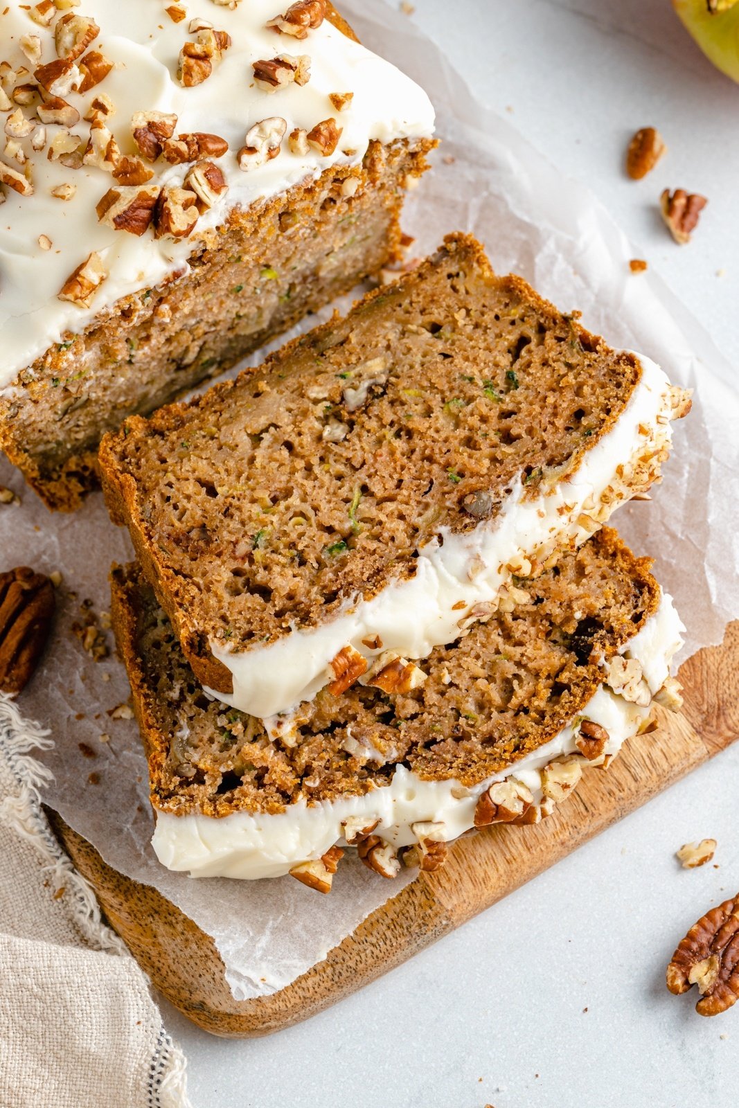 healthy apple zucchini bread sliced on a cutting board