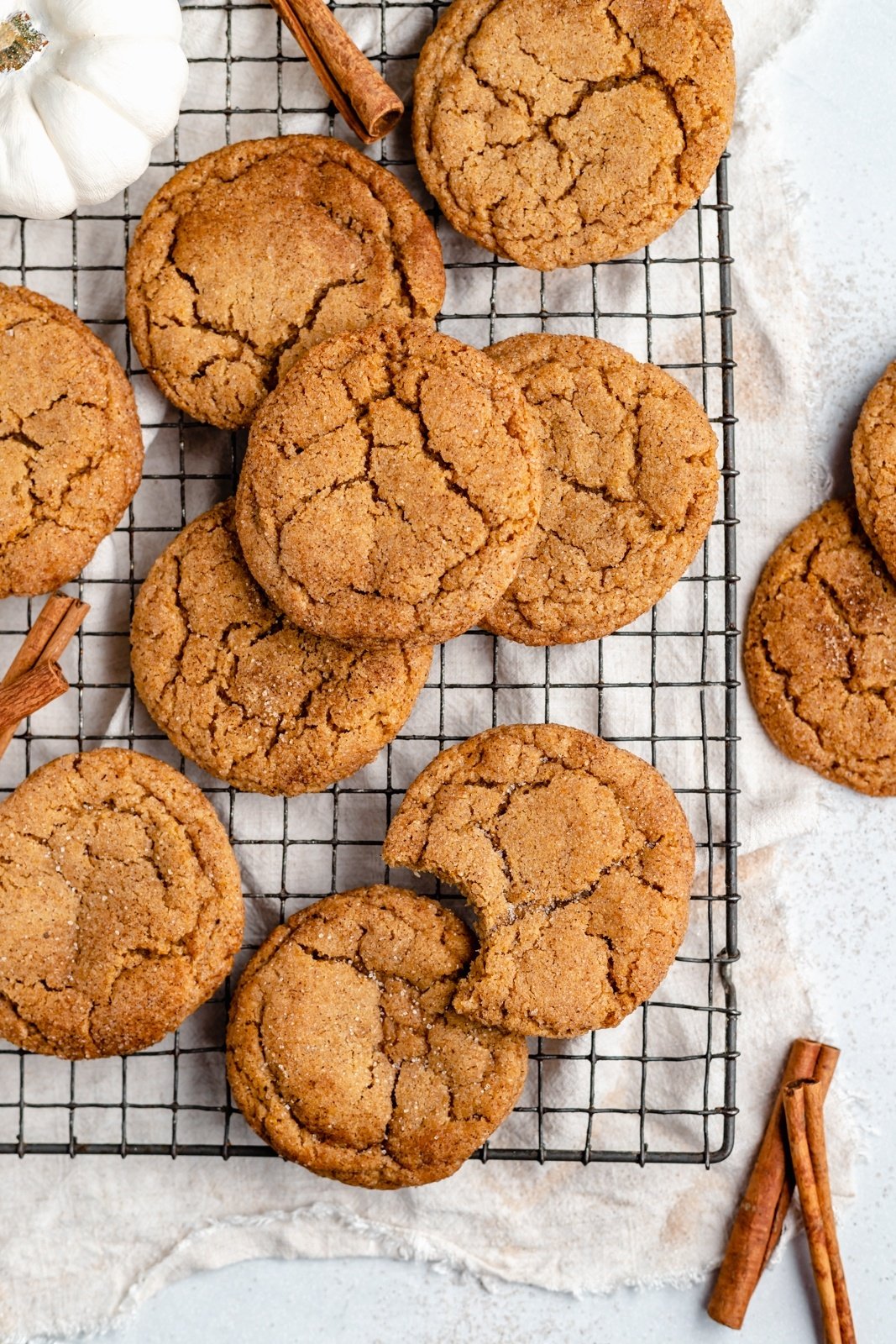 homemade pumpkin snickerdoodles on a wire rack