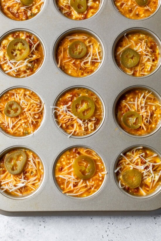 Pour egg mixture in the muffin tin.