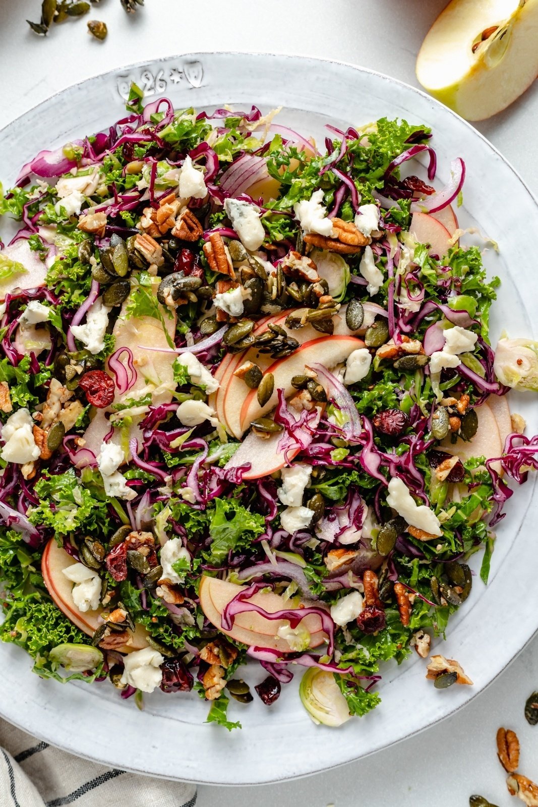 brussels sprouts kale apple salad on a plate