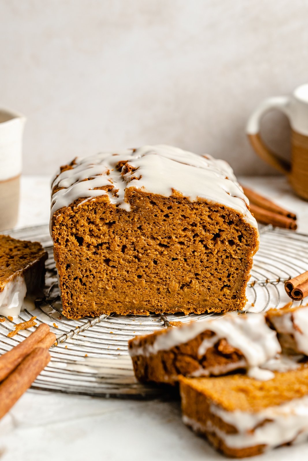 healthy pumpkin loaf sliced on a wire rack