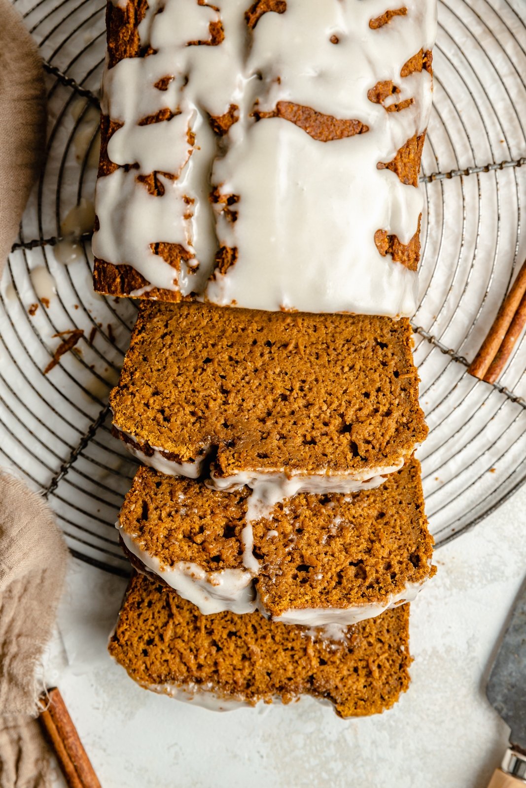 healthy pumpkin bread sliced on a wire rack