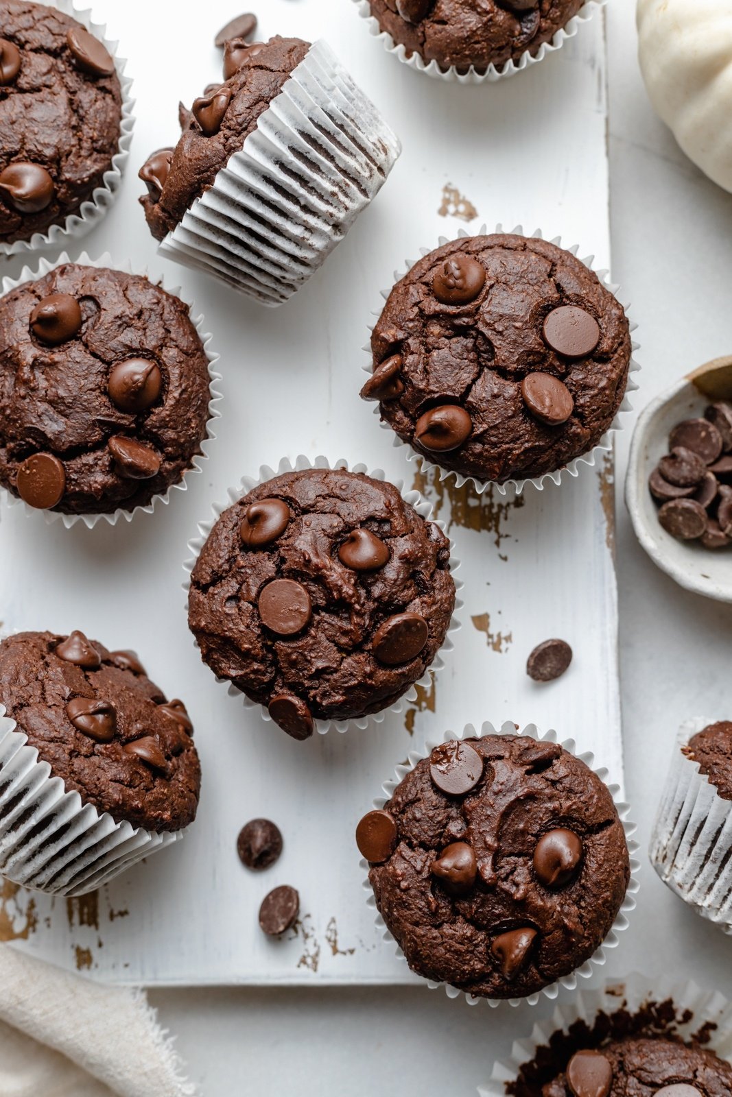 almond butter chocolate pumpkin muffins on a marble board