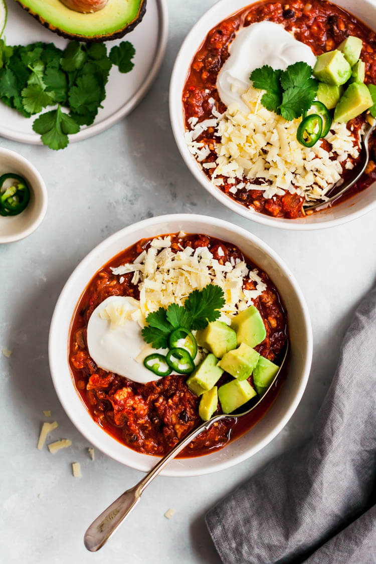 slow cooker pumpkin turkey chili in two bowls