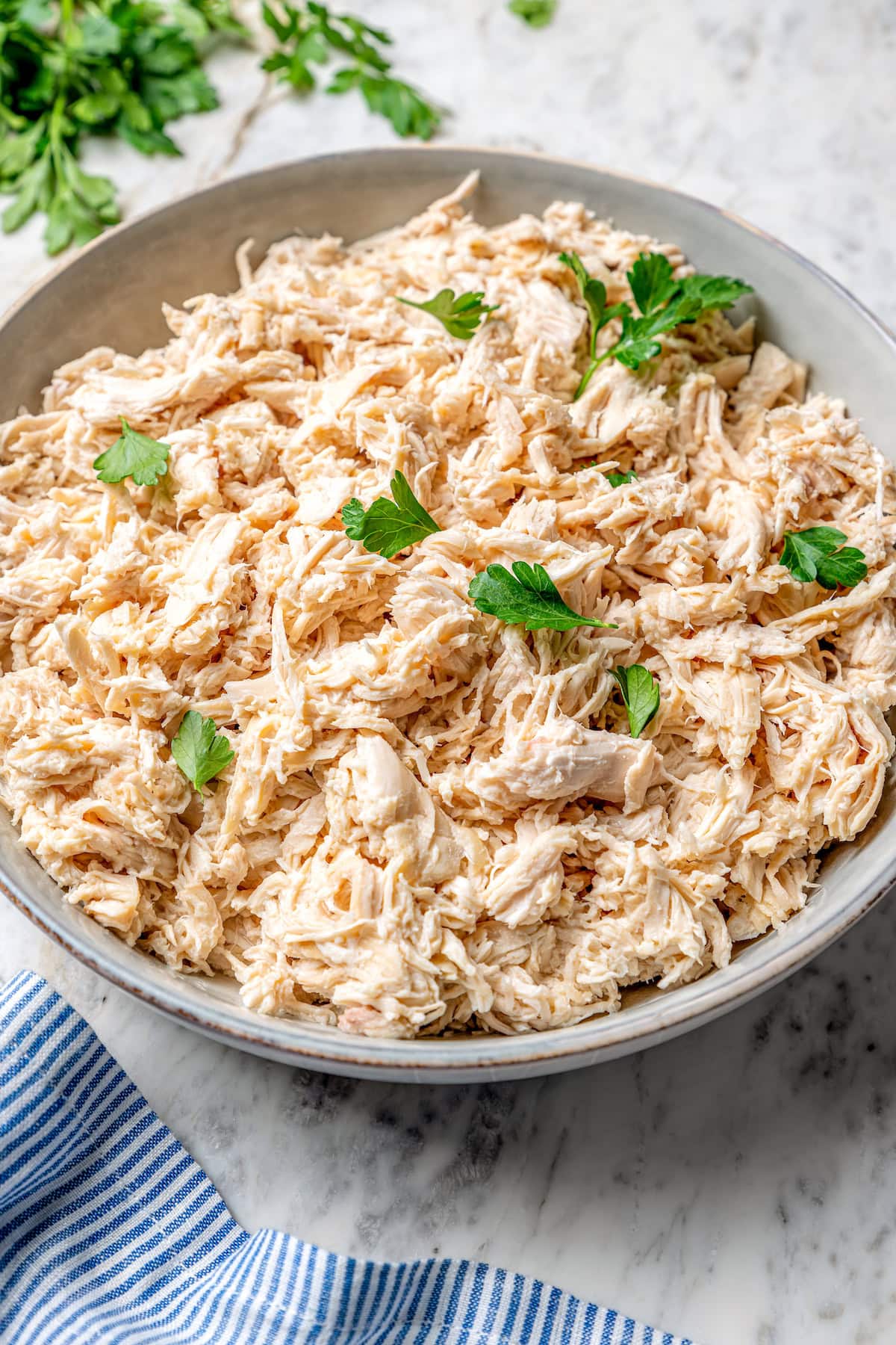 Bowl of crockpot shredded chicken