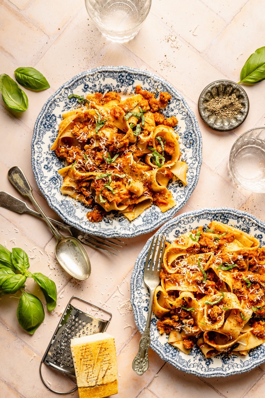 two plates of pasta with healthy meat sauce