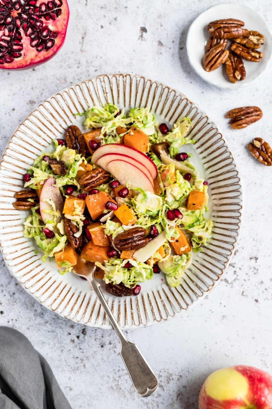 butternut squash brussels sprouts caesar salad on a plate