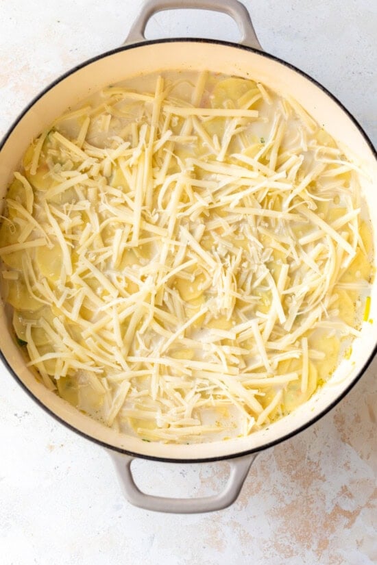 Top with milk and shredded cheese then bake.