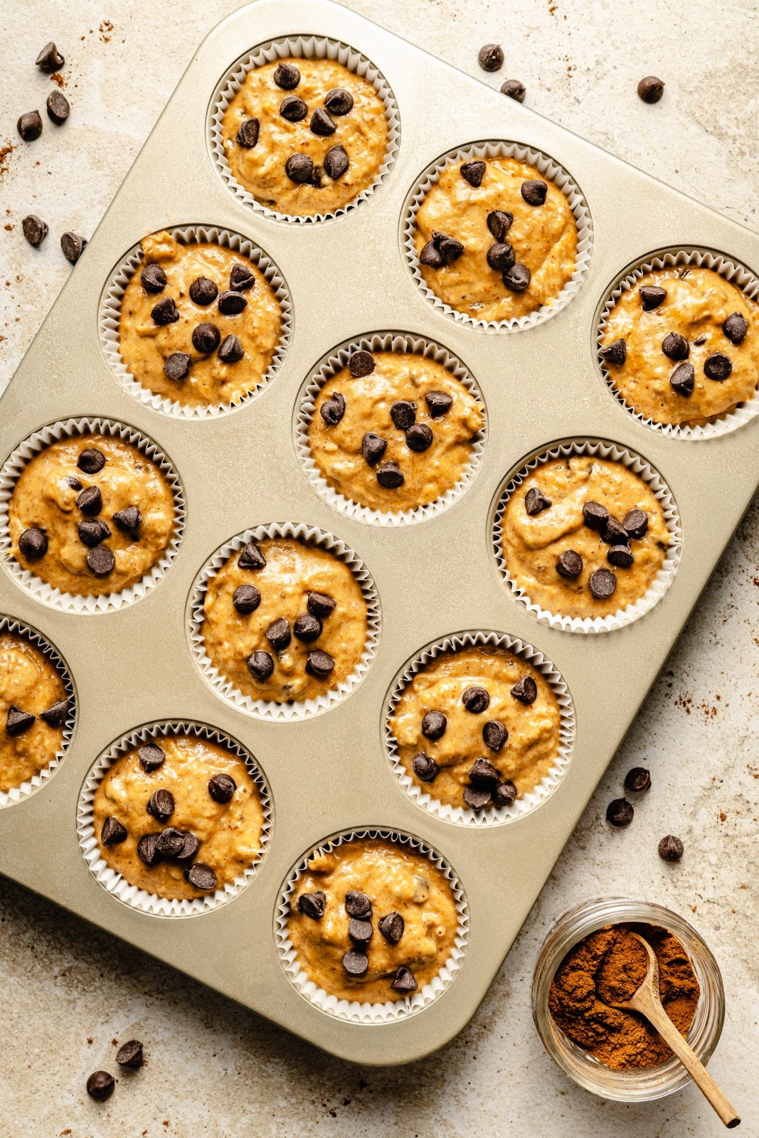 unbaked pumpkin banana muffins in a muffin tin