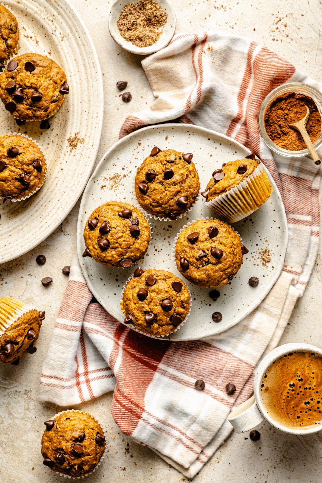 healthy banana pumpkin muffins with chocolate chips on plates