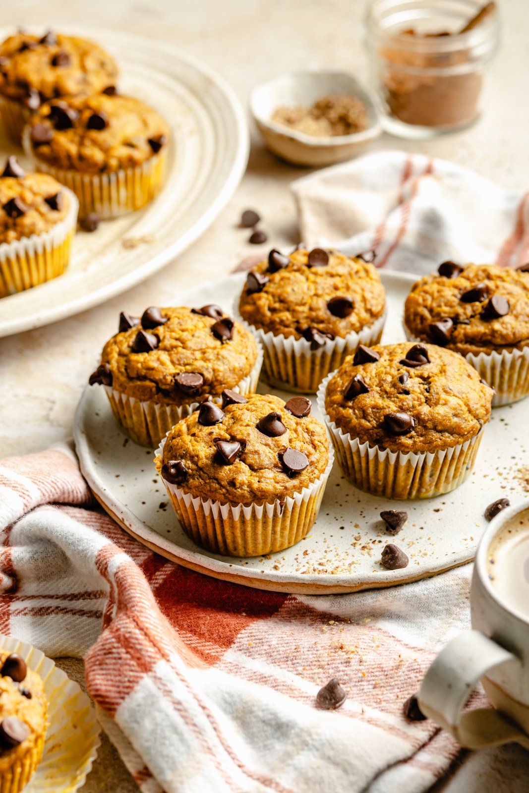 banana pumpkin muffins with chocolate chips on a plate