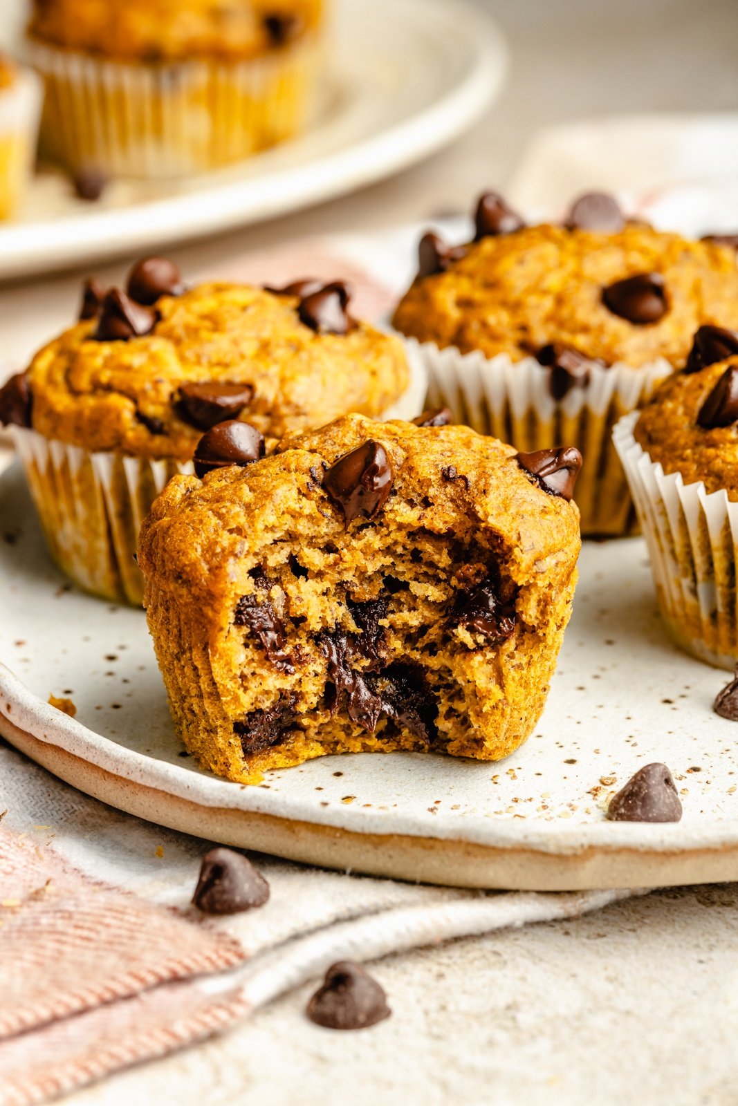 banana chocolate chip pumpkin muffin with a bite taken out