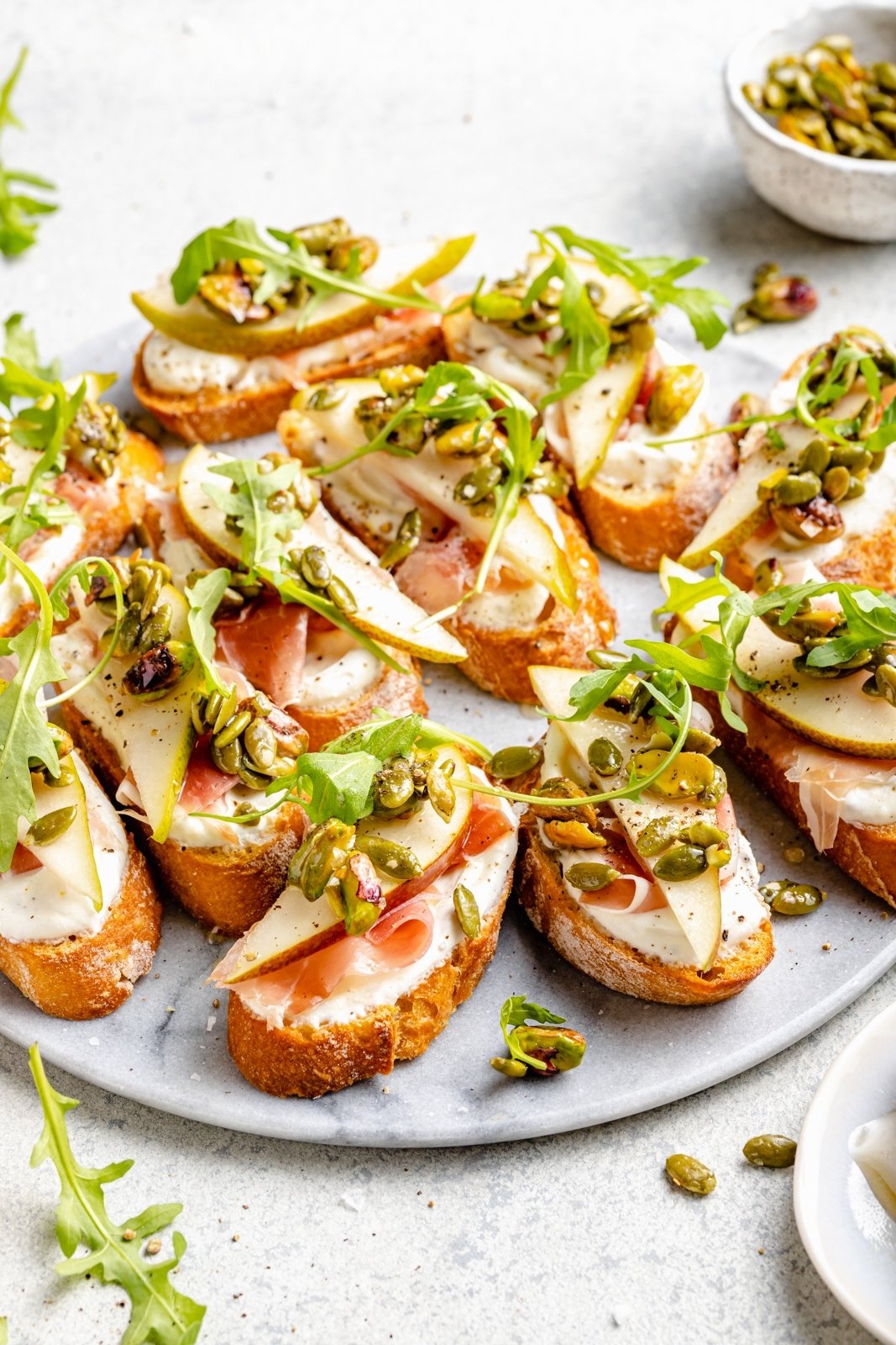 ricotta pear crostini on a serving platter