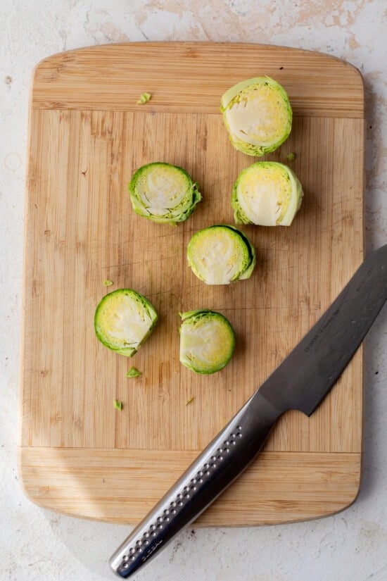 Cut the brussels sprouts in half.