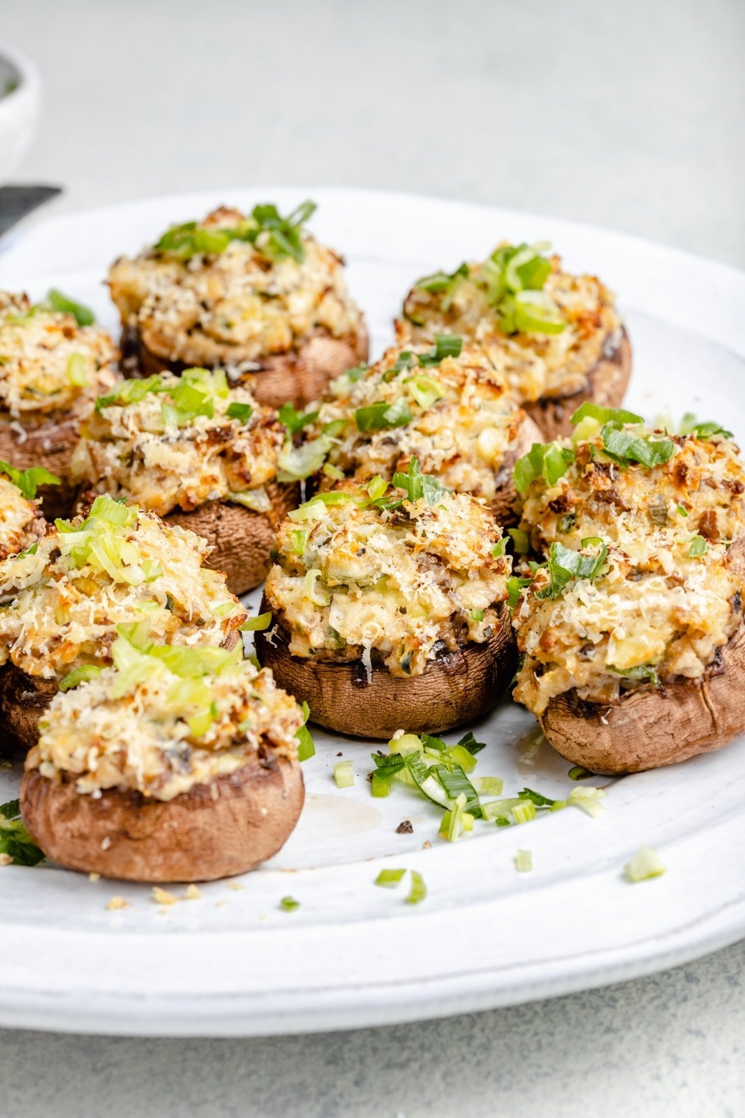 Over 20 of the best Thanksgiving appetizers that are guaranteed to impress family and friends! You'll find unique crostini recipes, savory handhelds, delicious dips, and more for your Thanksgiving menu or to bring as a guest this holiday season. These easy Thanksgiving apps might just outshine the turkey! jalapeño popper stuffed mushrooms on a plate