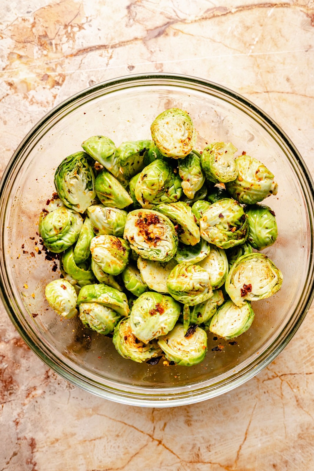 brussels sprouts in a bowl with chili crisp