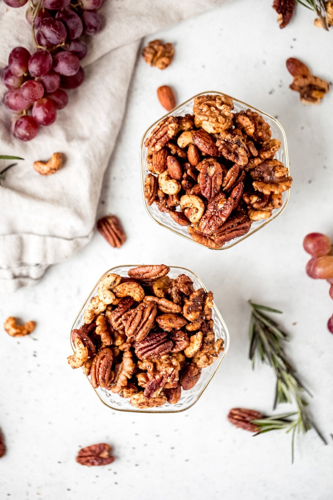 sweet and spicy nuts in two glass bowls