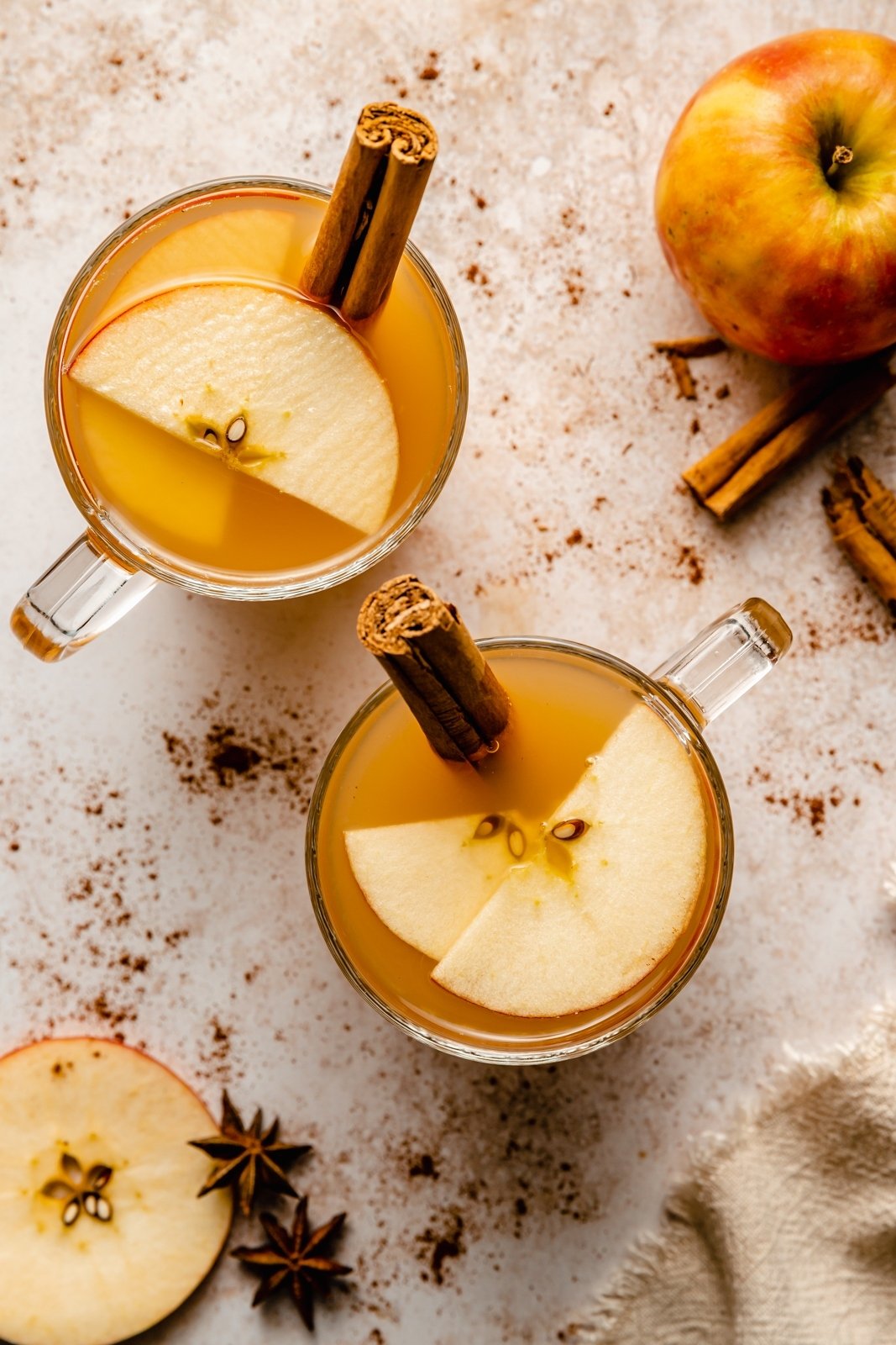 top-down view of two apple cider hot toddies