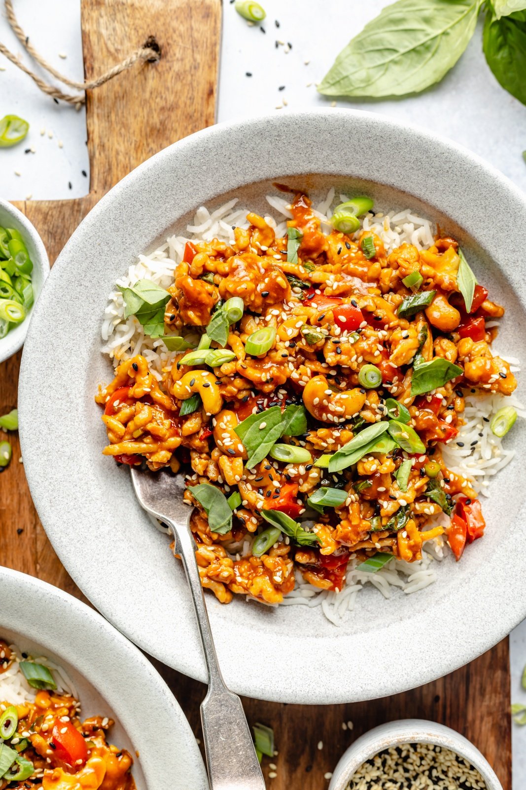 gochujang chicken bowls topped with basil