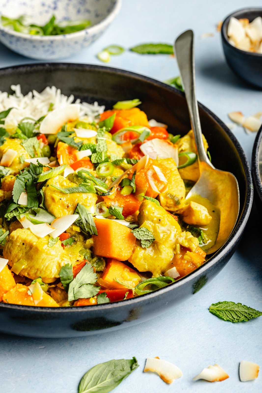 one pot chicken green curry in a bowl with rice