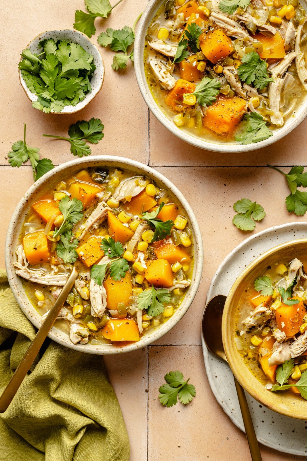 green chile butternut squash chicken soup in 3 bowls