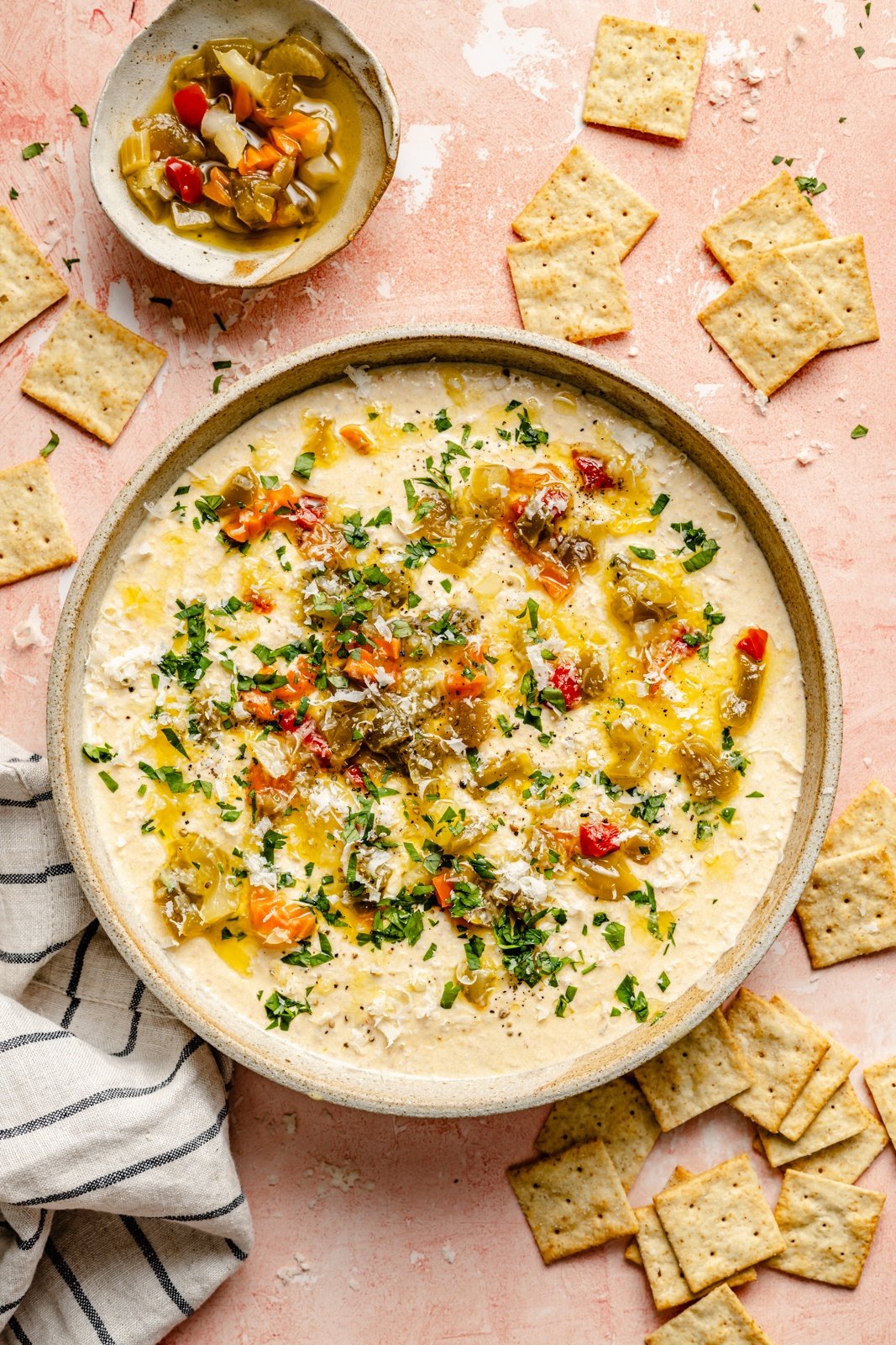 high protein cottage cheese giardiniera dip in a bowl next to crackers