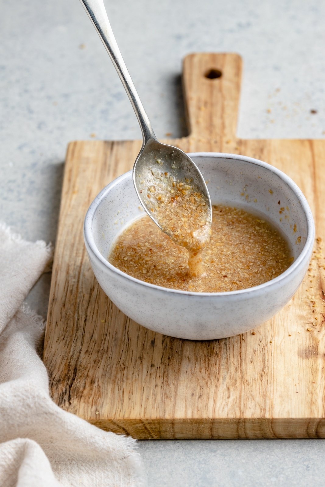 spooning up a flax egg from a bowl