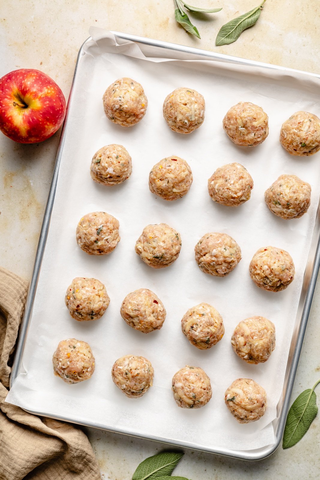 unbaked chicken breakfast meatballs on a baking sheet