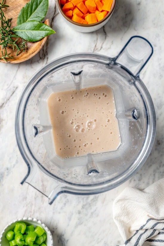 This delicious, hearty navy bean soup is inexpensive and easy to make! Cook it on the stovetop, or in your Instant Pot or slow cooker. Pureed beans in blender