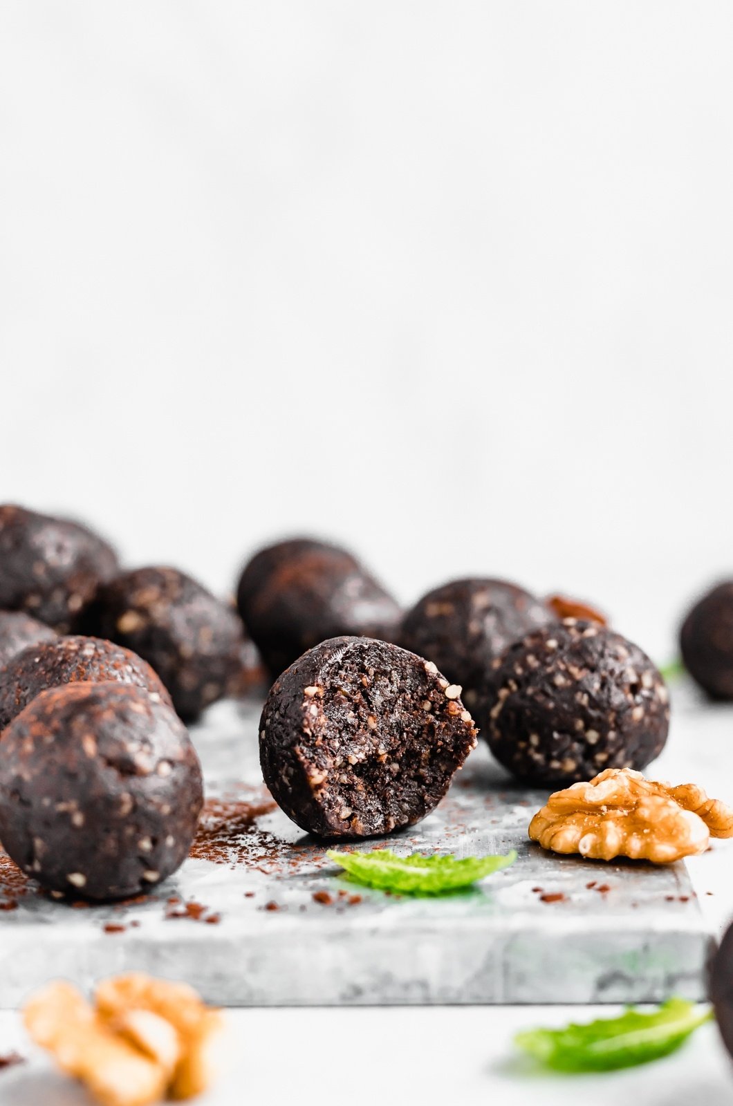 mint chocolate energy bites on a marble surface