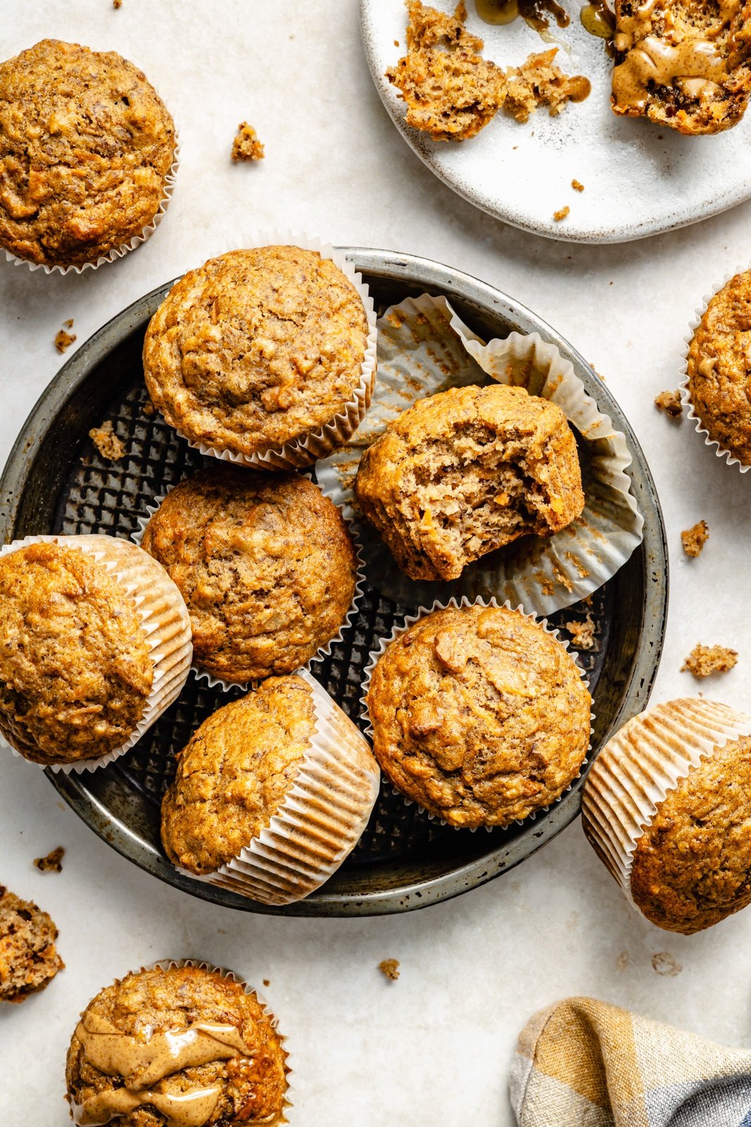 apple, banana, and carrot muffins on a plate