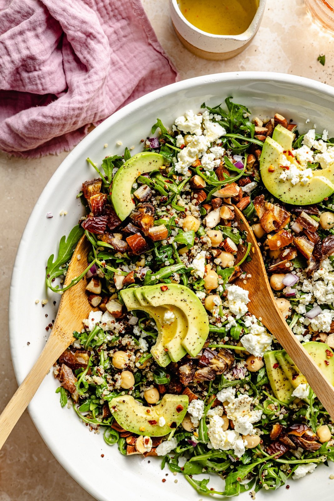 vegetarian chickpea arugula quinoa salad in a bowl with avocado