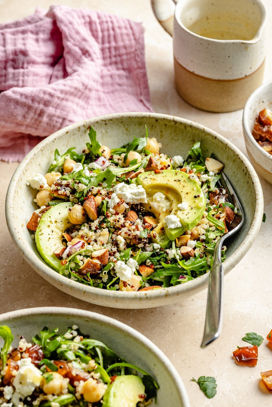 the best arugula quinoa salad with chickpeas and avocado in bowls