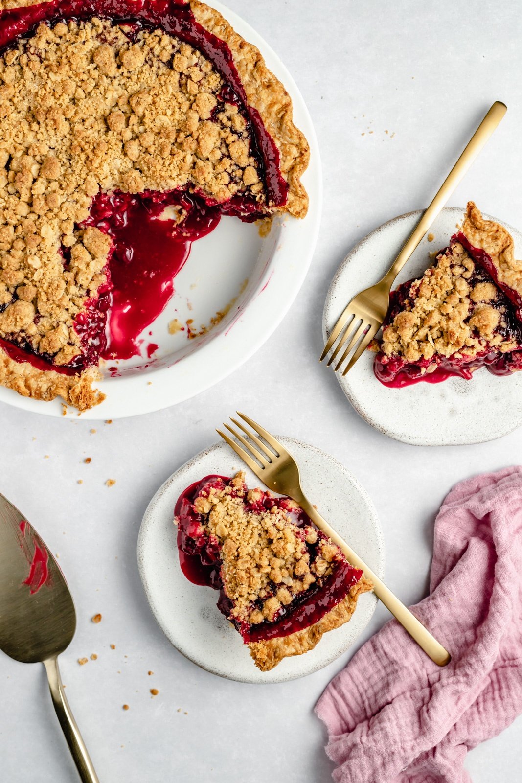 tart cherry pie in a pie pan and on two plates