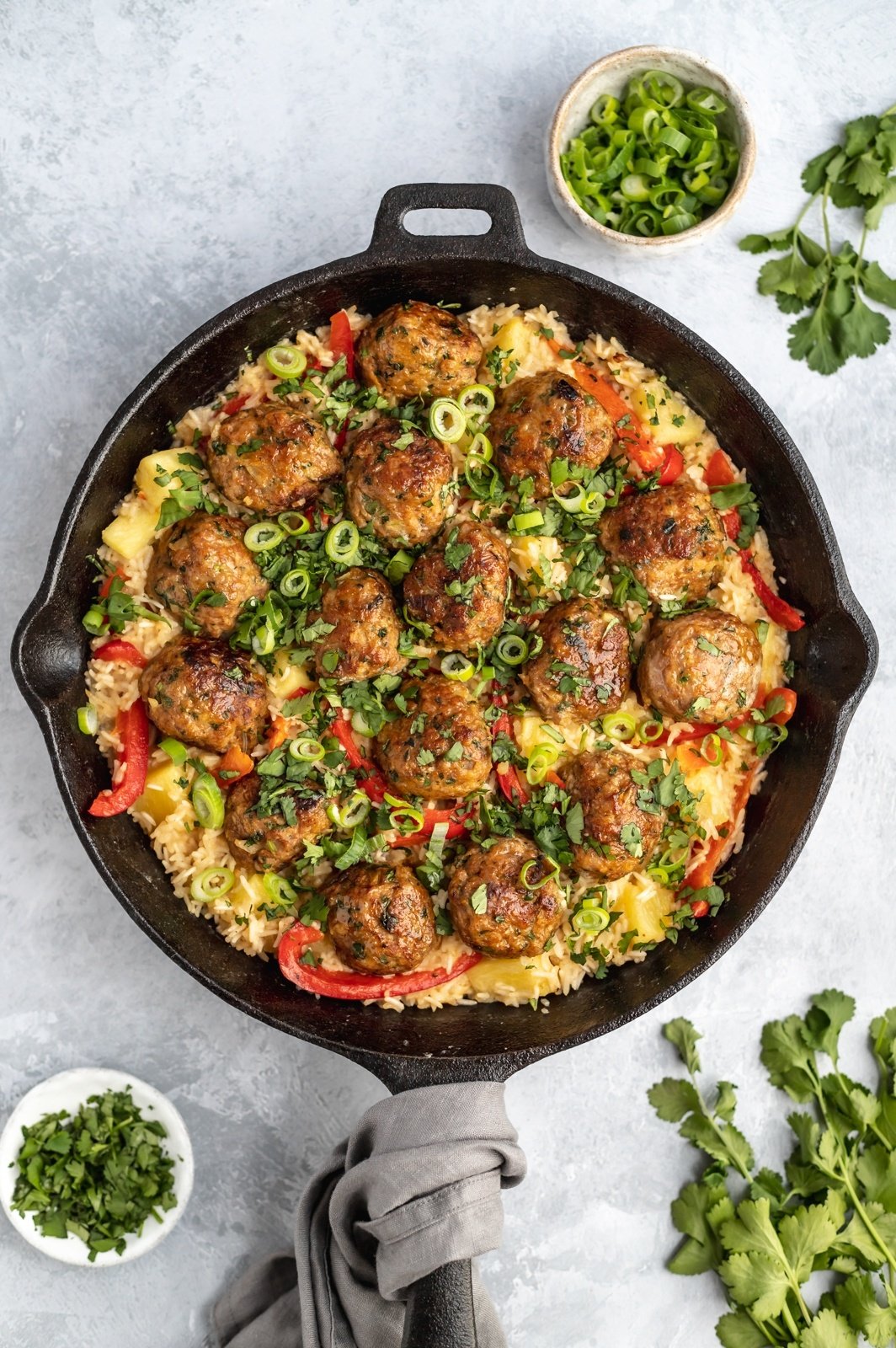 firecracker chicken meatballs and rice in a pan