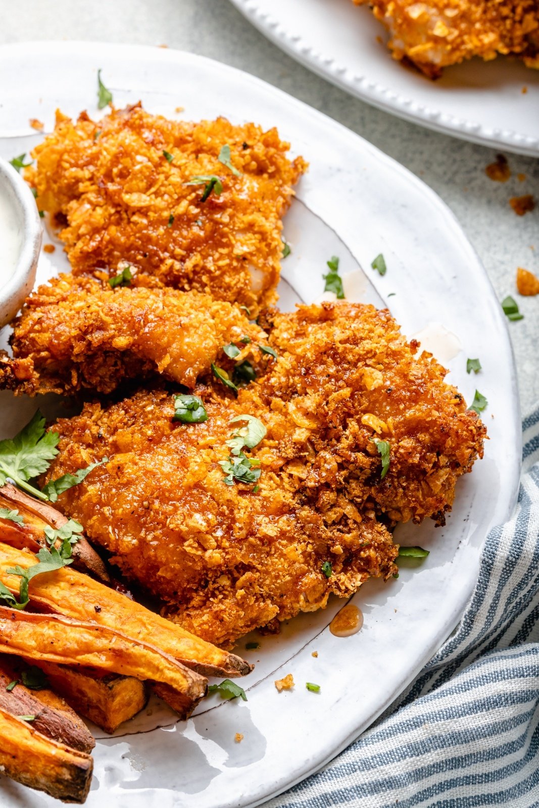 cornflake baked chicken on a plate
