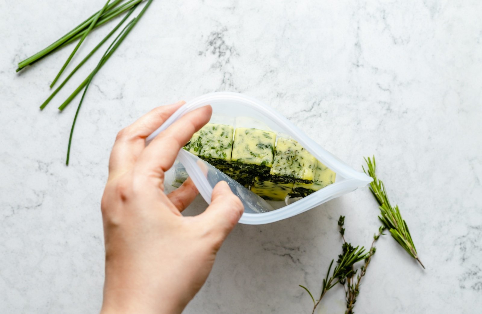 frozen herbs in a reusable silicone bag