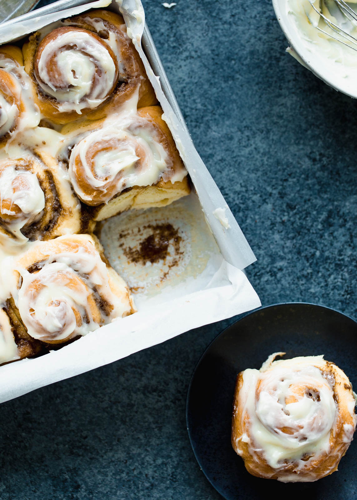 cinnamon rolls in a pan and on a plate