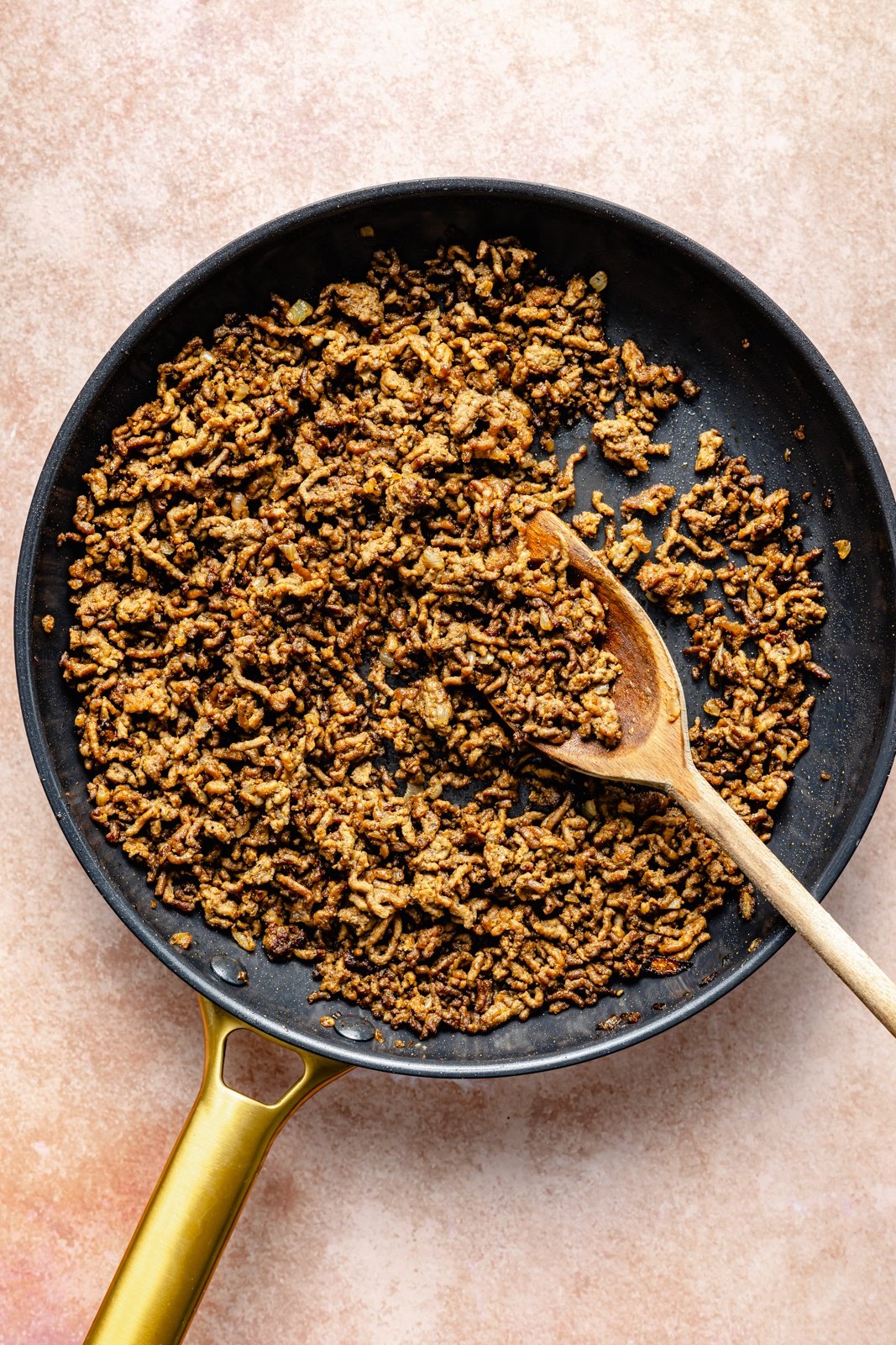 cooking beef in a skillet to make Turkish pasta