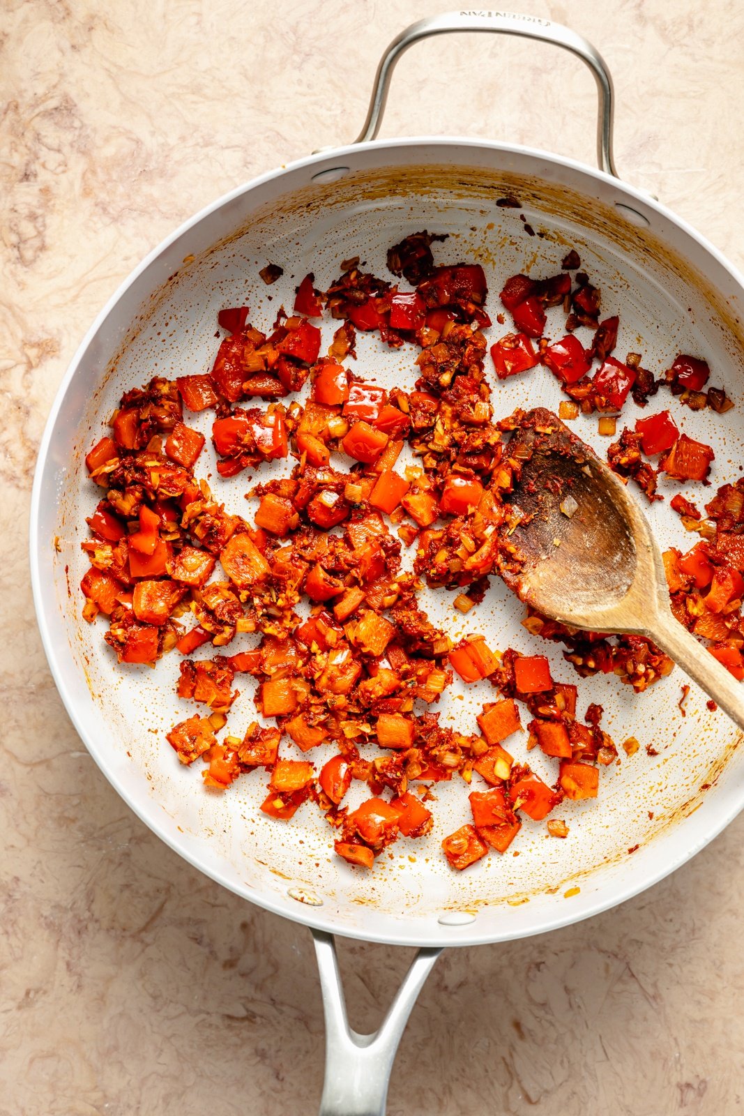 cooking veggies and spices in skillet