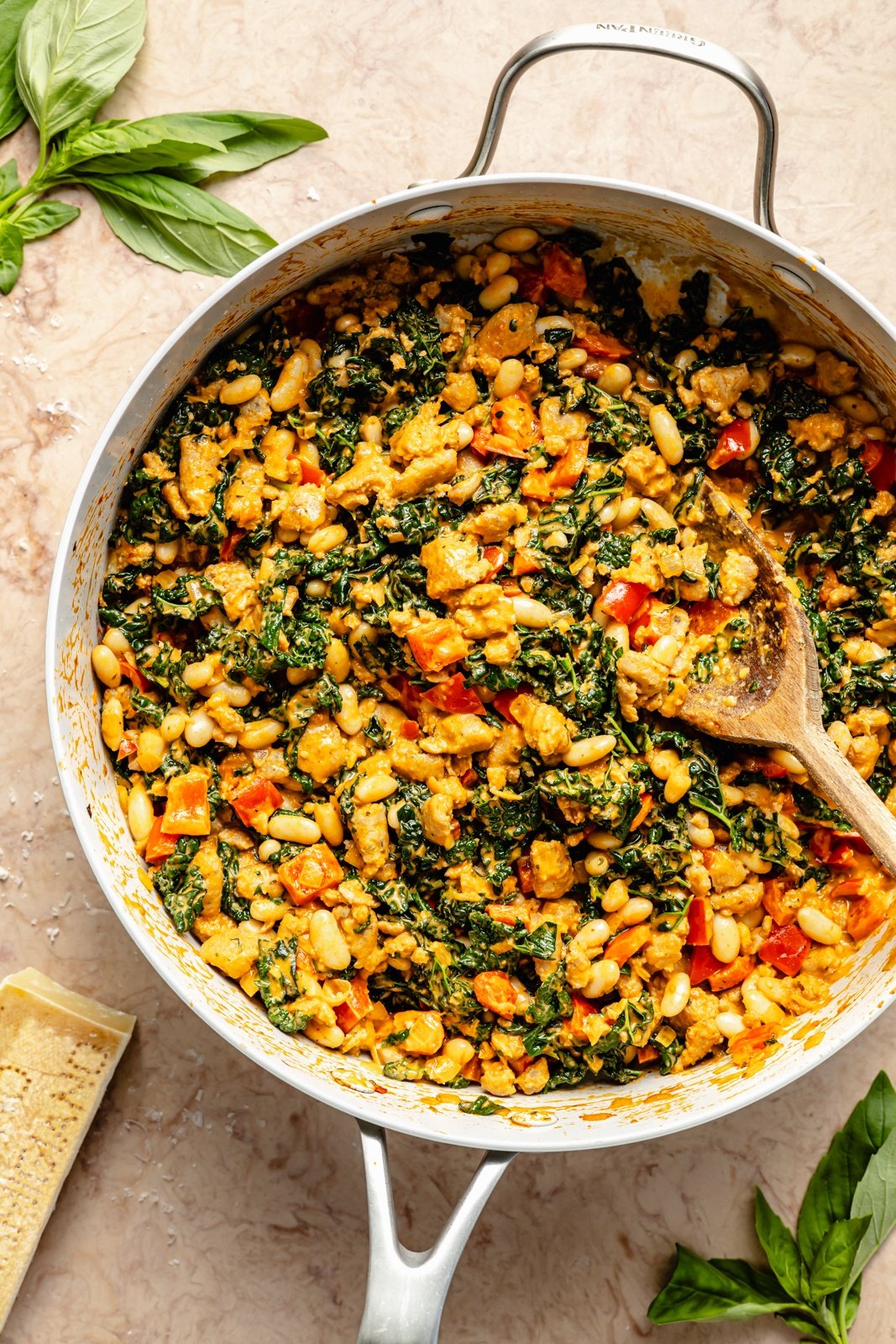cooking a chicken sausage white bean bake in a skillet