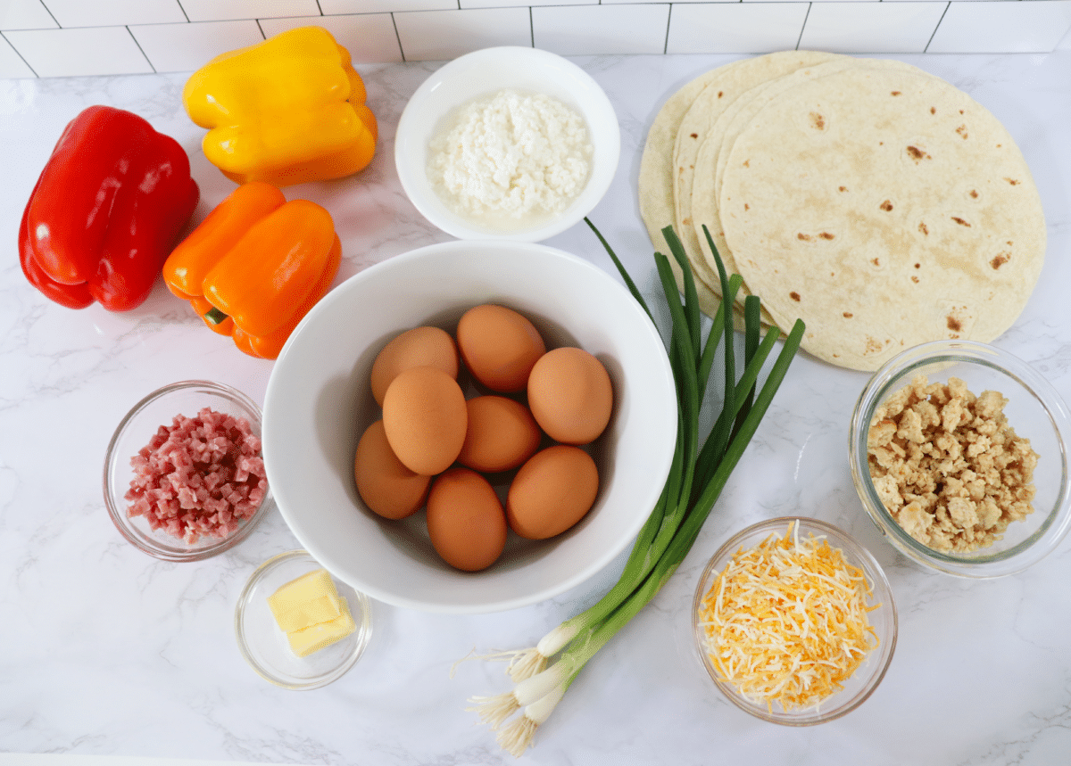 Ingredients needed to make breakfast burritos with veggiesf