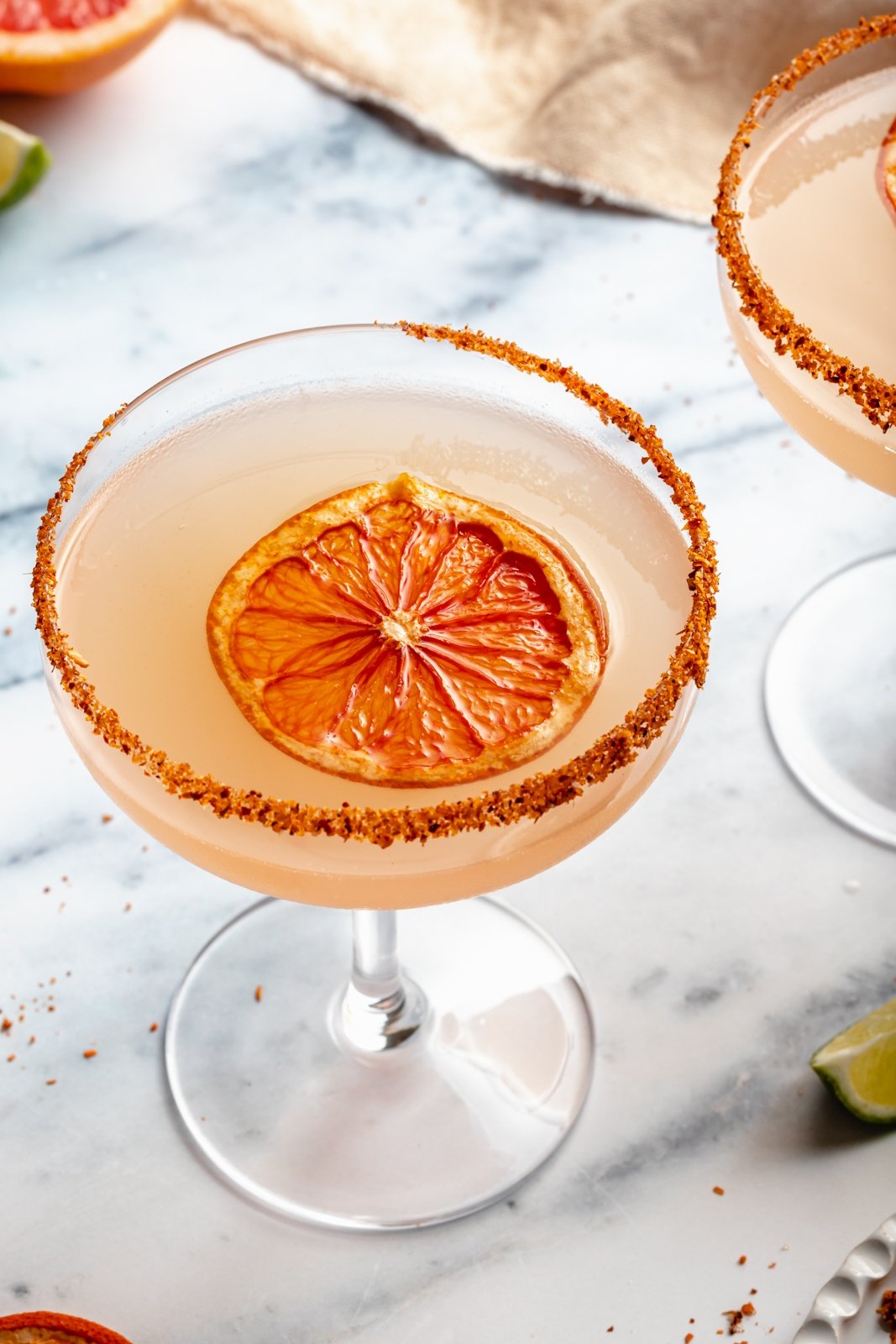 easy grapefruit margarita in a glass with a dried grapefruit slice