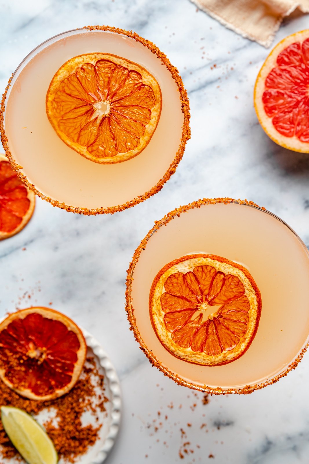 top-down view of two grapefruit margaritas