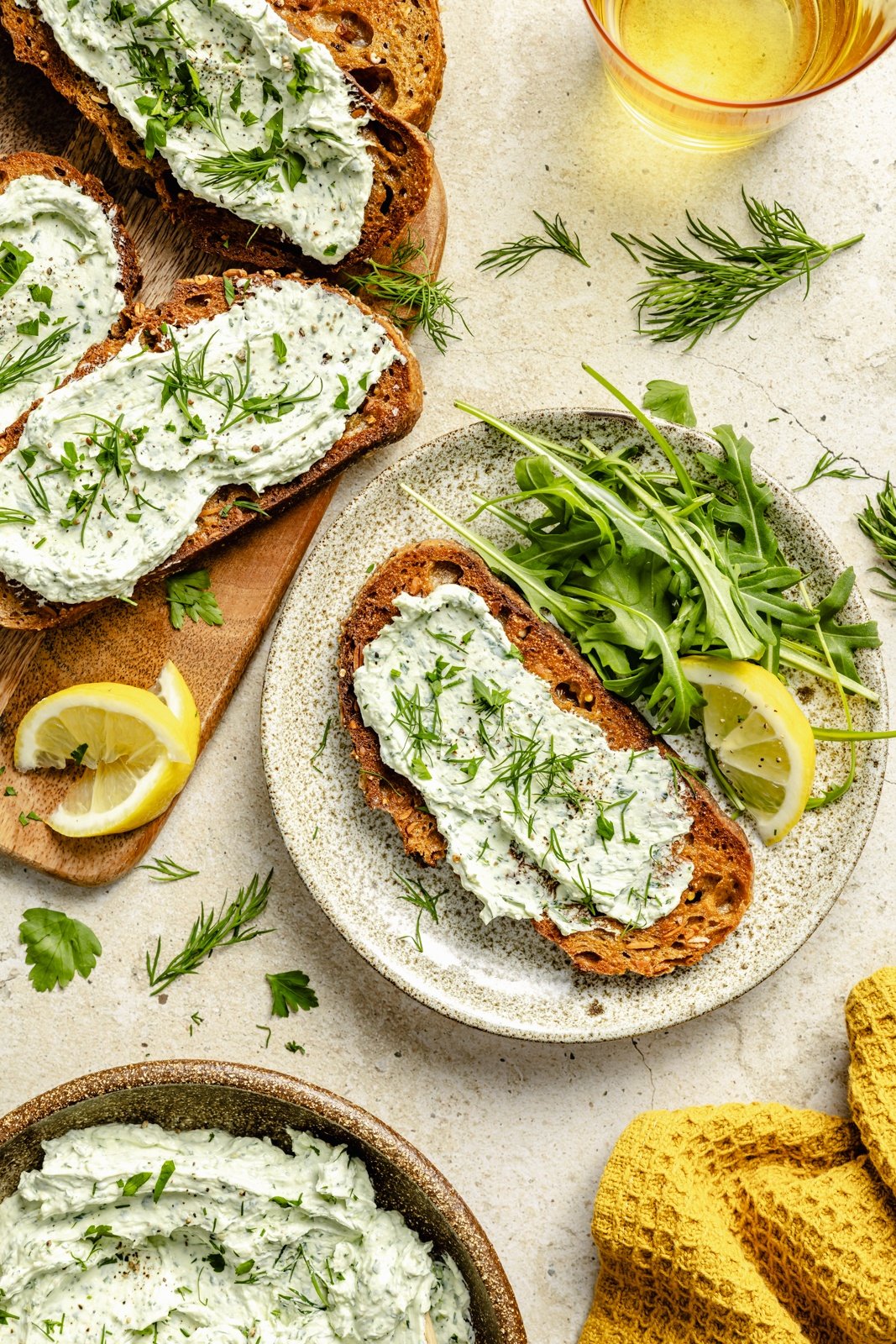 herbed goat cheese spread on slices of toast