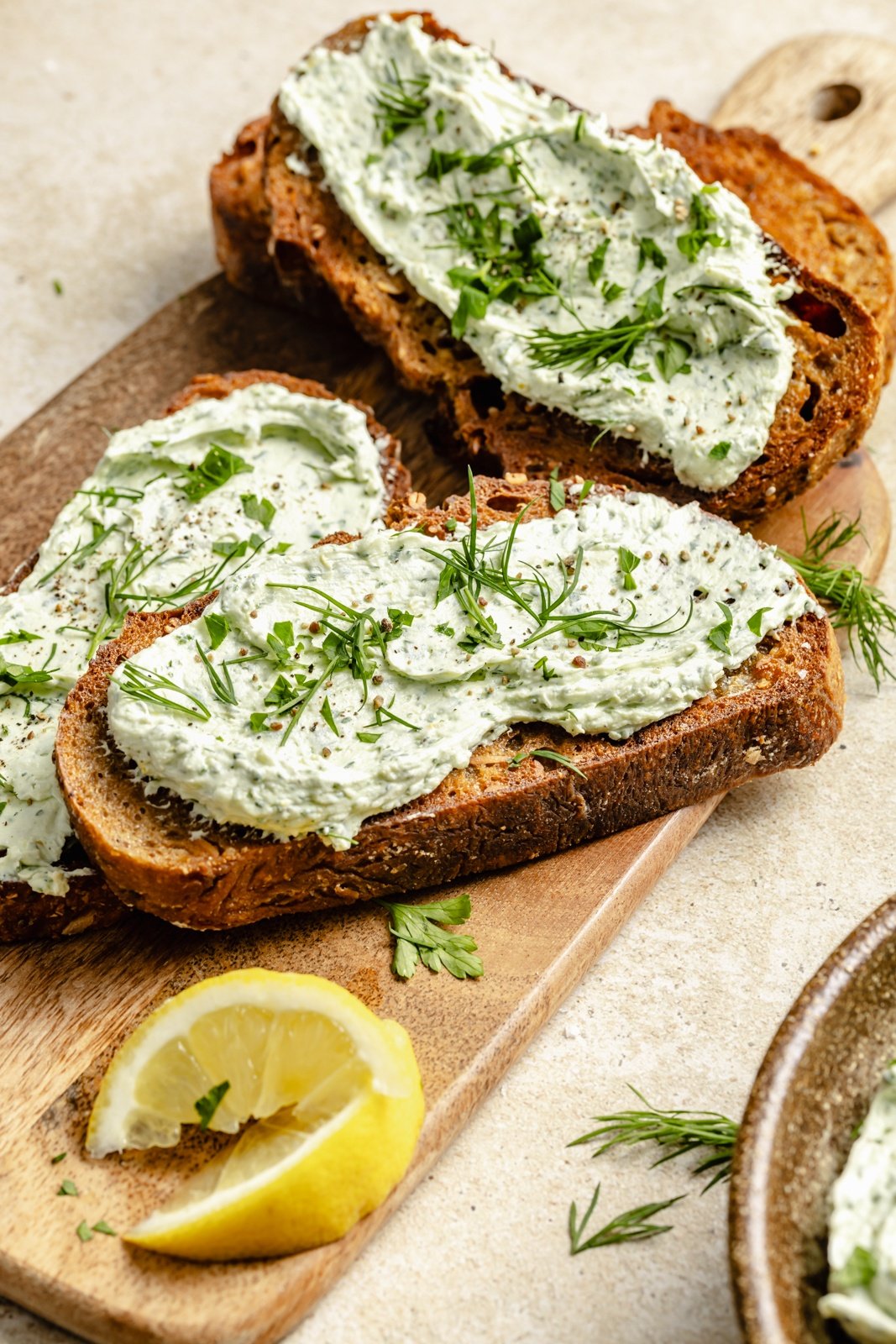 herbed goat cheese spread on slices of toast