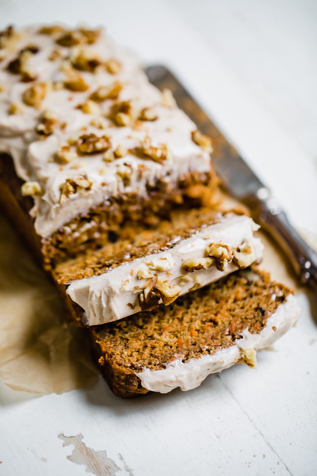 carrot cake banana bread sliced on parchment paper