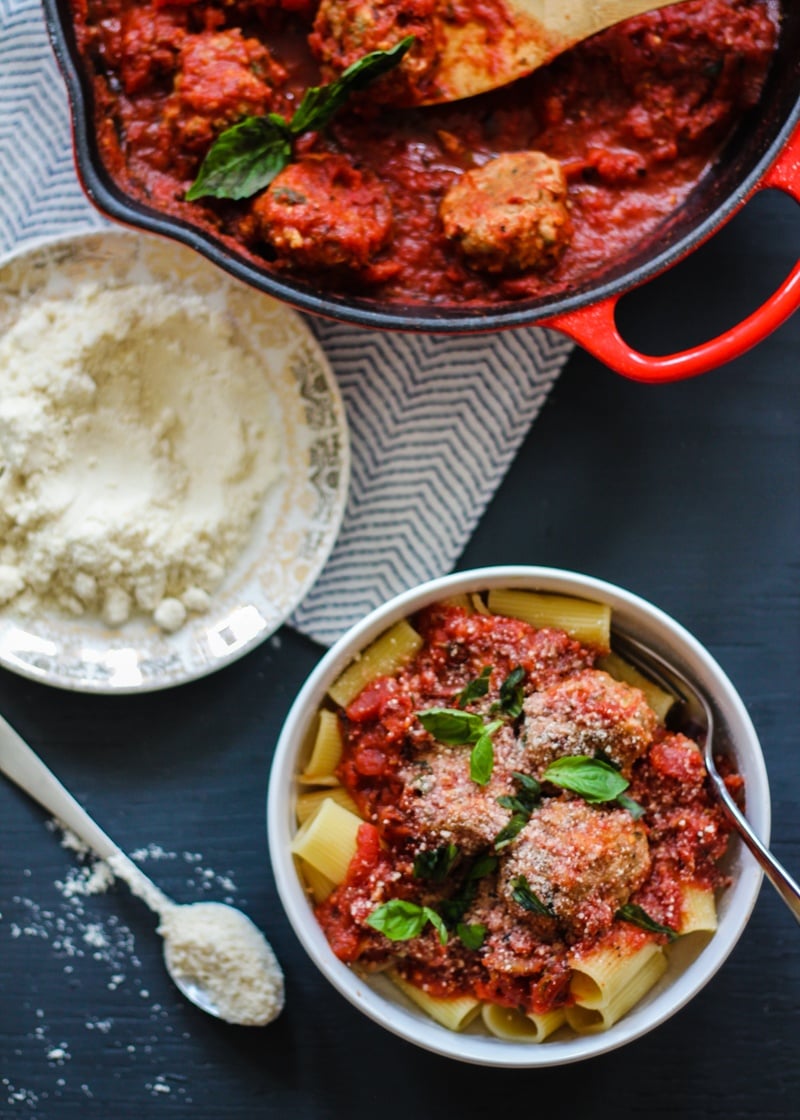 Turkey parmesan meatballs over rigatoni in a bowl